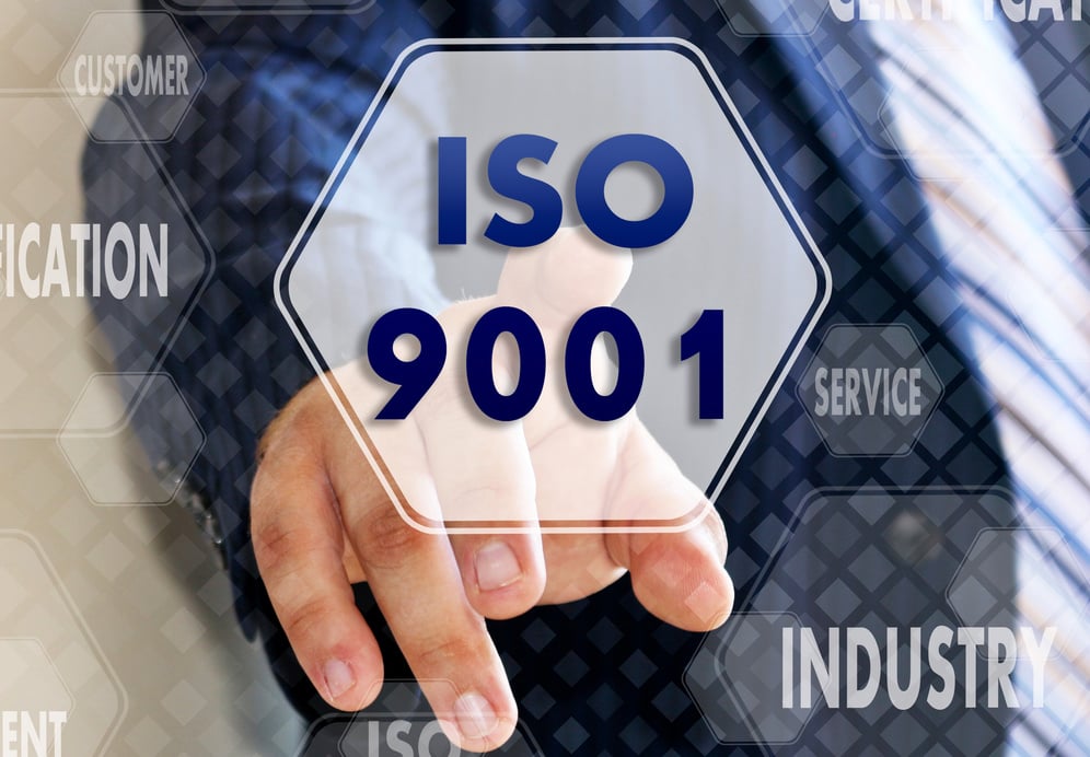 The businessman chooses ISO 9001, presses a button on the touch screen